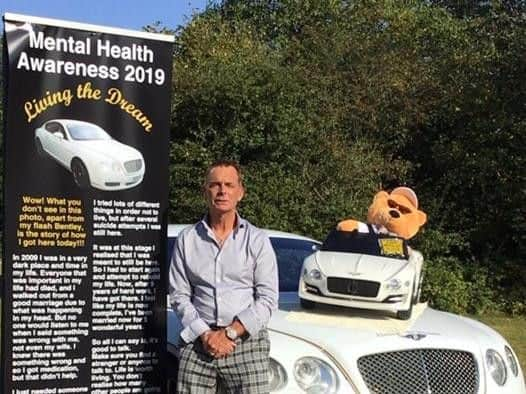 Mike with his car and banner