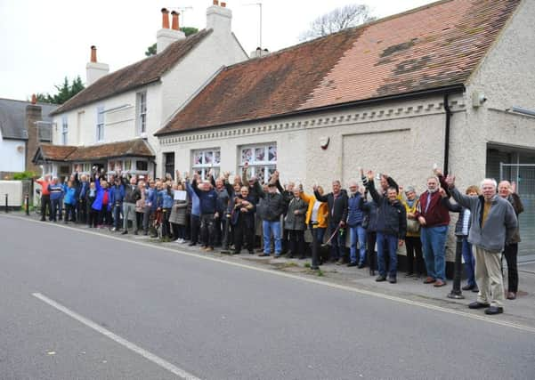 Residents gather outside the former Ship Inn in Aldwick