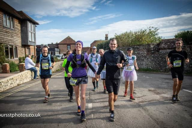 Luretta and John on their wedding day half way through Beachy Head Marathon. Photo by Matthew Harmer