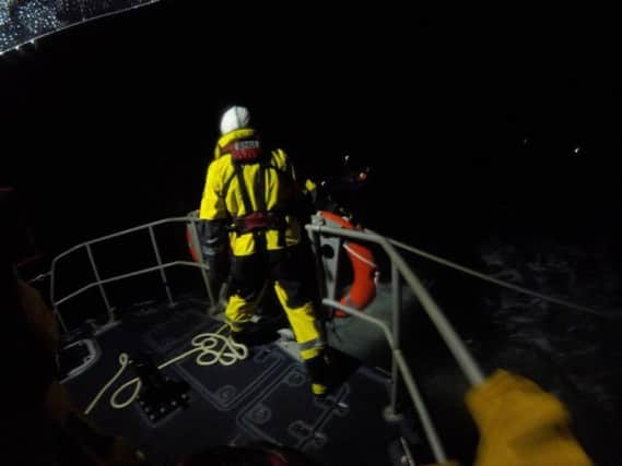 RNLI crews work to save the stricken vessel