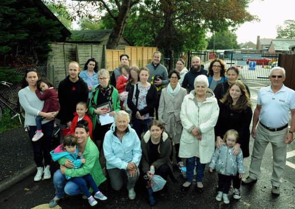 Concerned and shocked residents, past and present parents and former students of Rumboldswhyke school have rallied against the closure proposal. Photo: Kate Shemilt