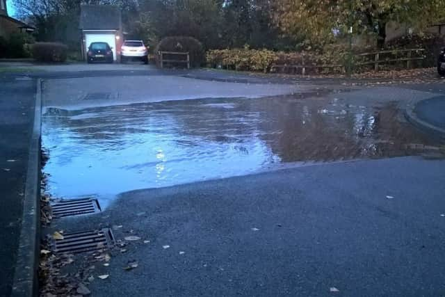 Dirty water escaping from manhole