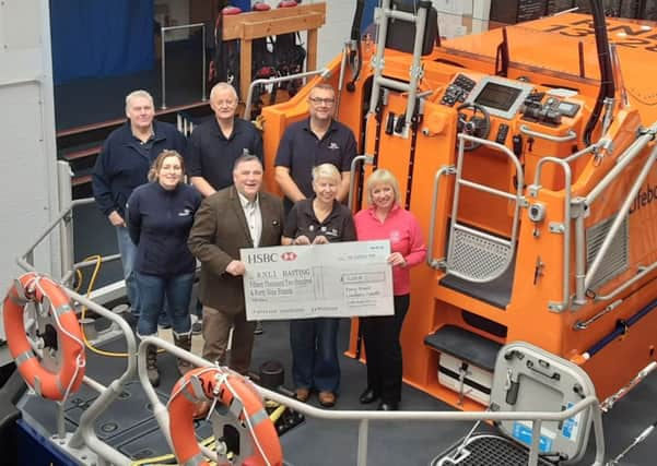 Cooden Golf Club RNLI cheque SUS-200120-102704001