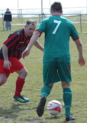 Rye United full-back Micky O'Callaghan keeps a close eye on Joe Briggs during the 1-1 draw at home to Pagham on Saturday. Picture by Simon Newstead