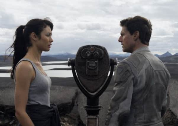 Tom Cruise and Olga Kurylenko in Oblivion.