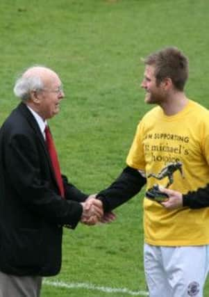 Danny Ellis receives his award from John Collins