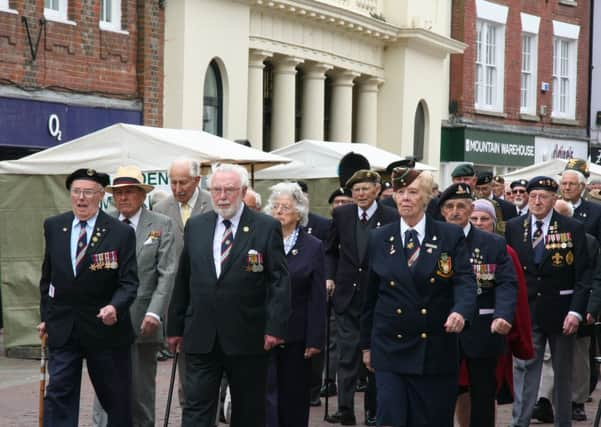 The  veterans march up North Street