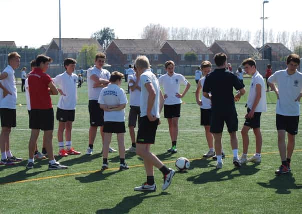 Young footballers enjoy the mash-up session at The Regis School