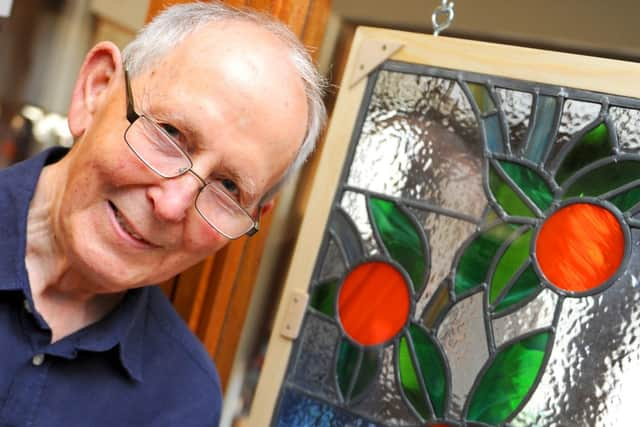 JPCT 010713 Light, Line and Form exhibition at Steyning Museum. Curator Chris Todd beside one of the exhibits. Photo by Derek Martin