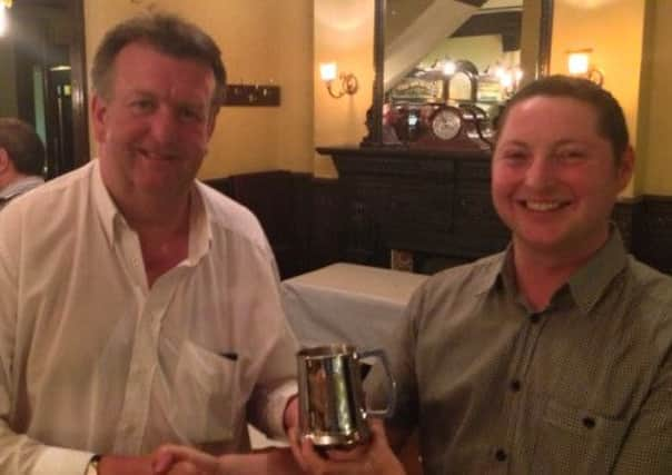 Johnny Moore receiving his award from Gary Alton, from Forest Hill