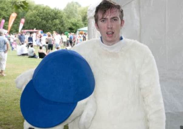 County Times reporter Joshua Powling as Chipper the dog helps set British record for most mascots doing the conga at Sparks in the Park, Horsham Park. (photo by Eddie Howland).