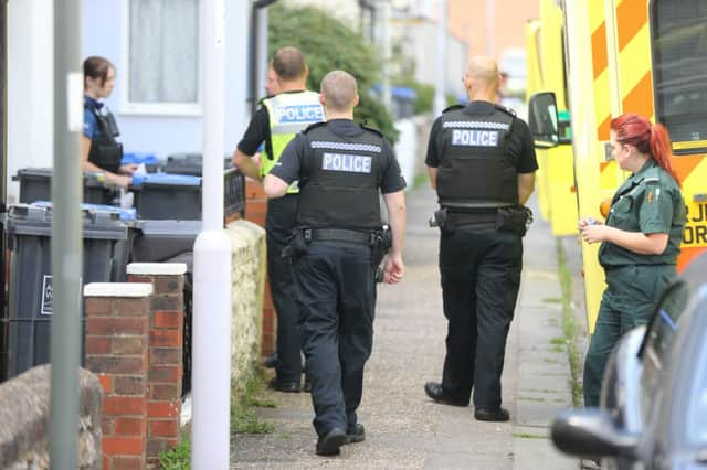 The scene, outside the woman's house