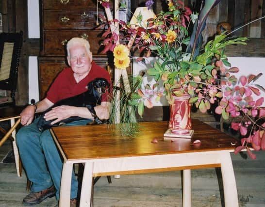 Christopher Lloyd with a vase