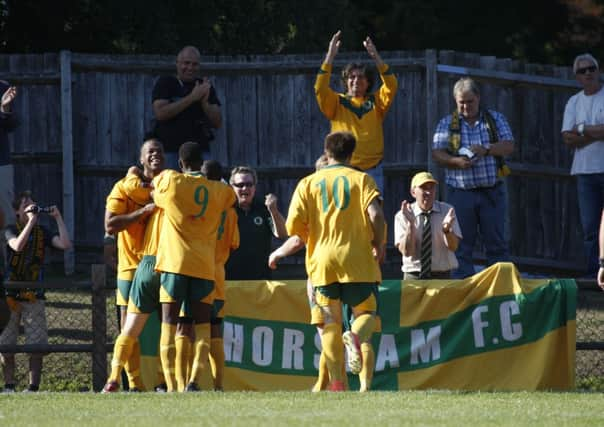 Horsham players celebrate at Walton and Hersham