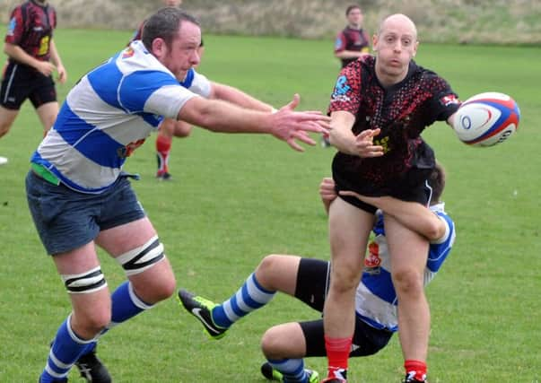 Two Hastings & Bexhill players pressurise a Southwark Lancers opponent during last weekend's 40-0 victory. Picture by Steve Hunnisett (eh41020c)