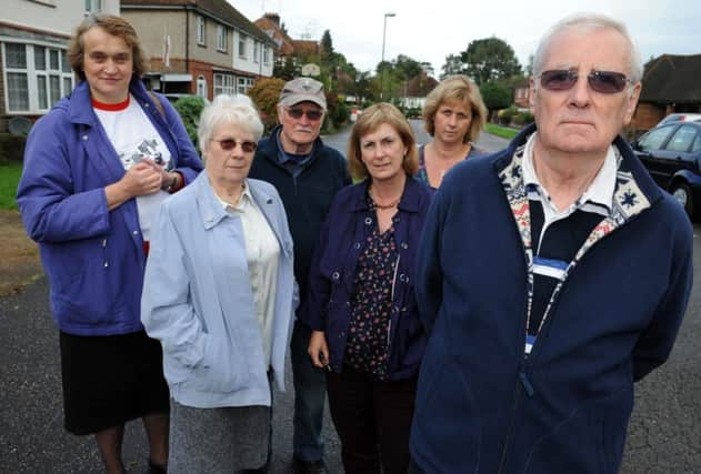 JPCT 141013 S13411213x  Horsham. Michael Cross, 71, and fellow residents are upset that the council has not fixed potholes in Springfield Crescent and Springfield Park Road -photo by Steve Cobb