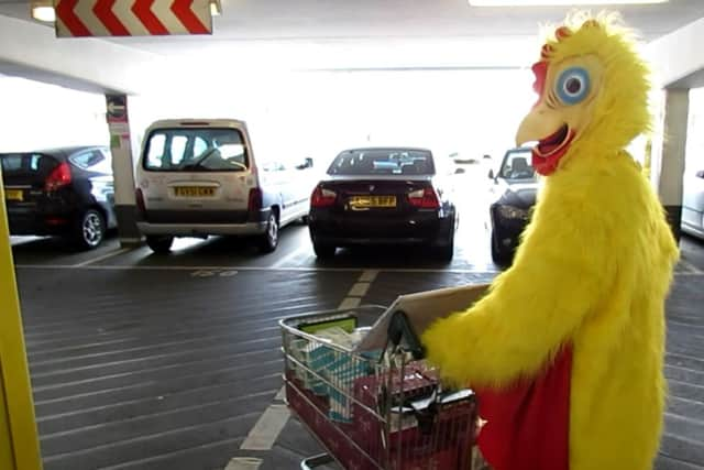 Chicken man hands out chocolate