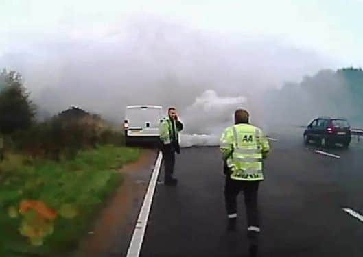 AA patrolman Phil Robinson runs to the rescue on the A27 near Holmbush