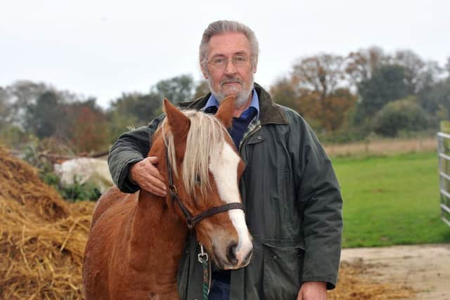 Peter Dean with his wife's pony which was shot in the chest with a crossbow bolt