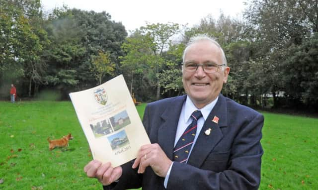 C131485-1 Bog Nov7 Aldwick  phot kate

Councillor John Hockenhull with the Aldwick village design statement on the village green.Picture by Kate Shemilt.C131485-1