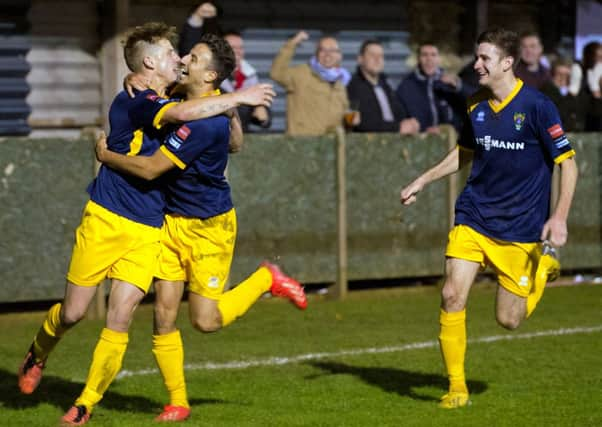 The Rocks celebrate the late penalty - won by Ollie Pearce - that earned them the points at Thamesmead  Picture by Tommy McMillan