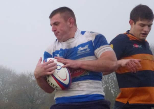 Jason Holewell wins a lineout for Hastings & Bexhill against Old Williamsonians. Picture by Simon Newstead