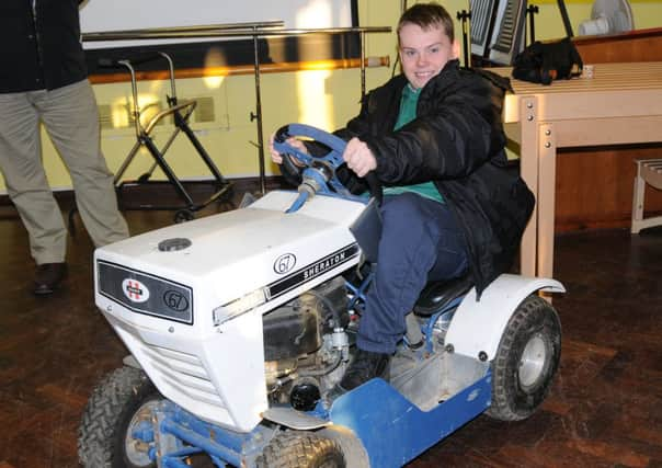 A cheque for the children of Ingfield Manor from  The British Lawn Mower Racing Association. Picture by Charlie Gould