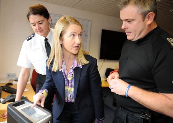 JPCT 291113 Launch of police drug-drive  testing equipment. L to R  Chief Inspector Natalie Moloney, Sussex Police and Crime Commissioner Katy Bourne and Sgt Stewart Goodwin looking at the equipment. Photo  by Derek Martin