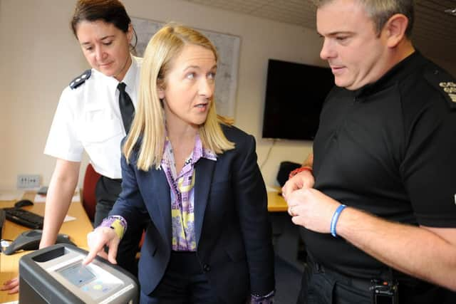 JPCT 291113 Launch of police drug-drive  testing equipment. L to R  Chief Inspector Natalie Moloney, Sussex Police and Crime Commissioner Katy Bourne and Sgt Stewart Goodwin looking at the equipment. Photo  by Derek Martin