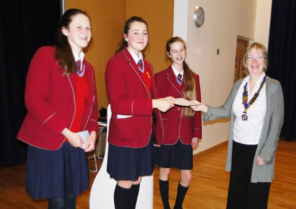 The Towers Convent speaker Georgia Saunders receives the winners' certificate from Rotary president Alison Boram