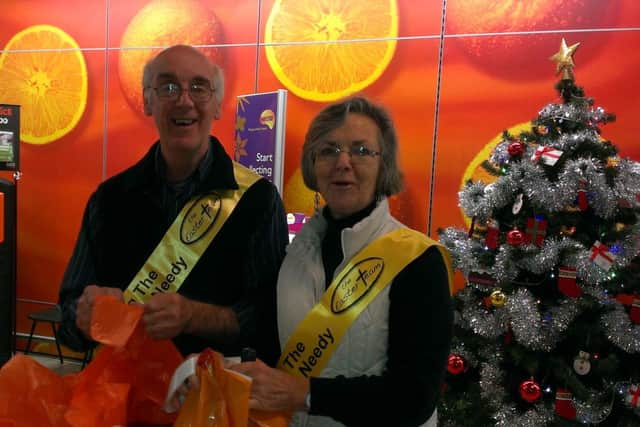 Rosemary and Ted Benwell from Crawley Easter team helping shoppers in Sainsbury's