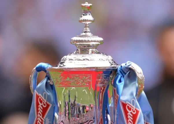 File photo dated 11/05/13 of the Budweiser sponsored FA Cup trophy  as it was announced that the BBC and BT Sport are to share the rights to broadcast the FA Cup under a new four-year deal which kicks off next year. PRESS ASSOCIATION Photo. Issue date: Wednesday July 17, 2013. The BBC's FA Cup programming will be led by Match Of The Day host Gary Lineker and the corporation said coverage will be available on TV and there will also be live streaming online and on mobile devices. The competition will be returning to the BBC for the first time since 2008. See PA story MEDIA FACup. Photo credit should read: Anthony Devlin/PA Wire