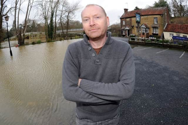 JPCT 070114 S14021085x Pulborough floods, White Hart pub Stopham Bridge,  owner Chris Sinfield -photo by Steve Cobb