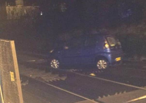 Car on Crawley level crossing