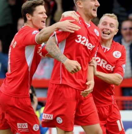 Crawley V Gillingham - Crawley players celebrate Kyle McFadzean's equaliser (Pic by Jon Rigby)