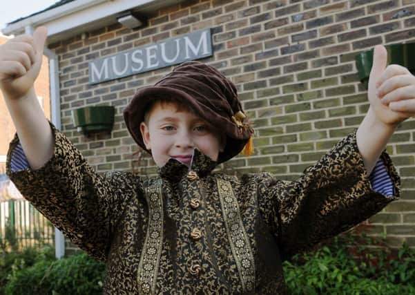 S08538H14 Laurie Williams enjoys dressing up at Steyning Museum