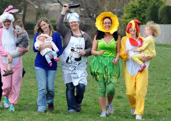 JPCT 070314 S14110283x Horsham. Jo Taylor (in blue top) with a group of mums who are running a 5km in Horsham later this month hoping to raise Easter eggs for ill children. -photo by Steve Cobb SUS-140703-131133001