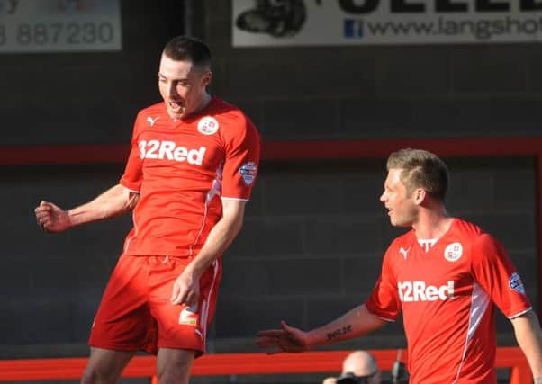 Crawley's Mike Jones scores against Colchester (Pic by Jon Rigby)