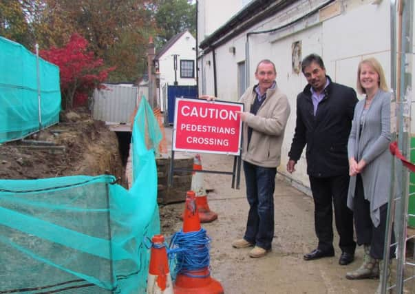 David and Carole Lawrence with Ramesh Shingadia during the Londis building works SUS-140319-102430001