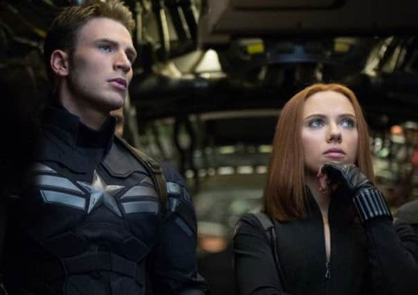 Chris Evans as Captain America and Scarlett Johansson as Black Widow