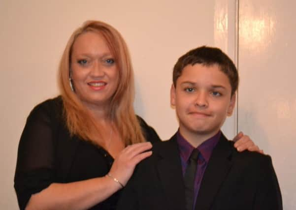 Tyler Murphy and his mother Janice Ellis SUS-140314-132826001