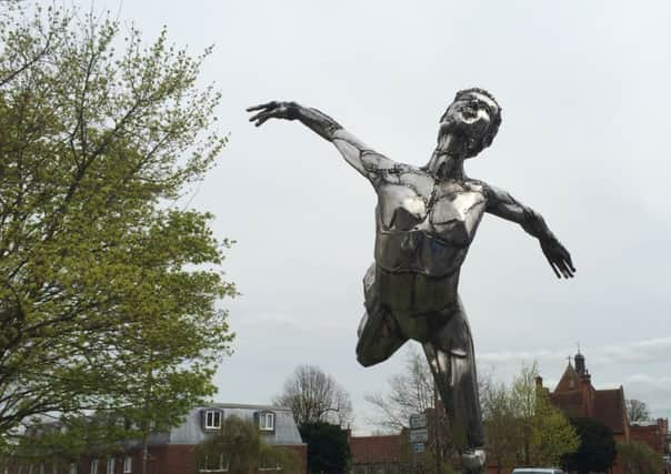 Silver balerina performs for drivers passing through Haywards Heath during Art Trail 2014