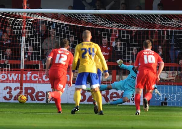 Paul Jones is beaten from the spot in the reverse fixture at the Broadfield which Brentford also won 1-0. Pic Jon Rigby