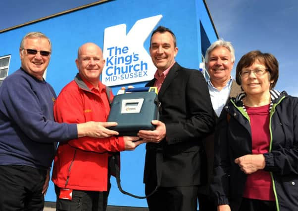 Lions give defibrillator to Kings Church. Alan Ranger(Lions health & safety officer), Derek Middlehurst (senior leam leader), Jim Partridge (senior pastor),  and Steve Pitt (chairman of the business park association) and Barbara Neal (Lion). Pic Steve Robards SUS-141004-163424001