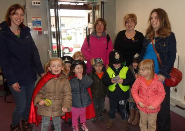 Rainbow Pre-School investigate 'The Great Storrington Bank Robbery' SUS-140415-153134001