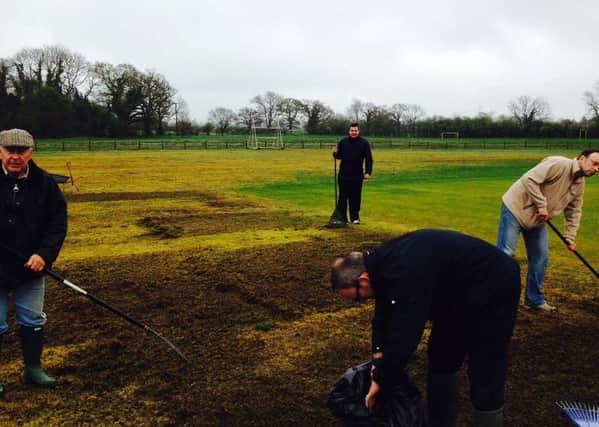 Cricket fans helping their local club