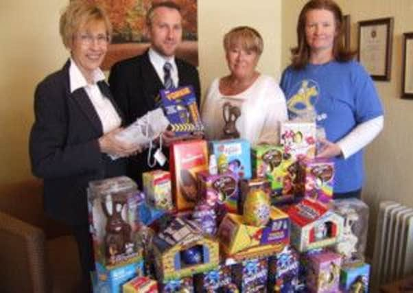 Funeral director, Janek Lewandowski, pictured with colleague Jane Sharpe, Rockinghorse campaigns manager, Louise Bartha, and Rockinghorse volunteer Jackie Tindley