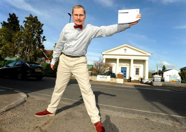 Trevor Butler is fuming at the change in electoral boundaries, behind him the polling station. Pic Steve Robards SUS-140426-174320001