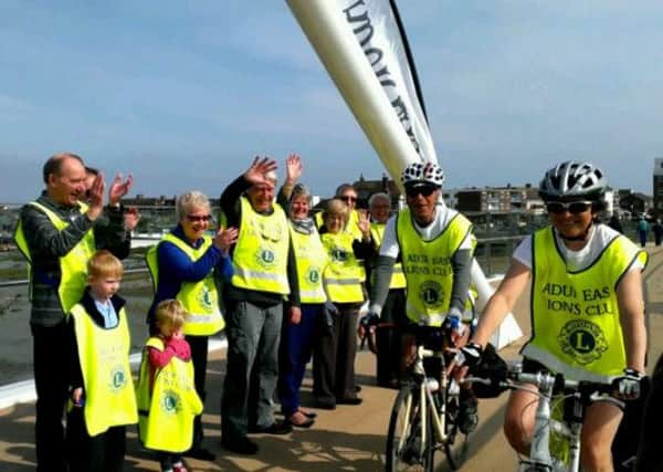 Maurice Allen and Susan Saunders are greeted by Adur East Lions on Adur Ferry Bridge