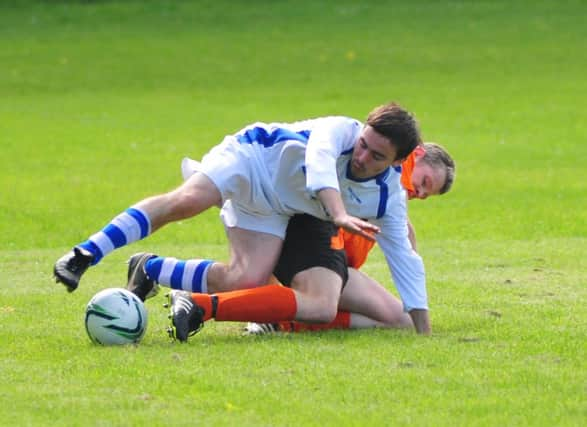 Sedlescombe Rangers and Orington tussle for possession. Picture by Steve Hunnisett SUS-141005-175440002